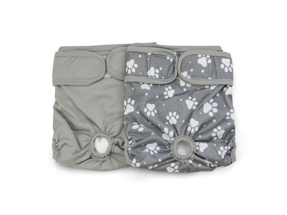 Two grey dog diapers, one solid and one with a paw print pattern.