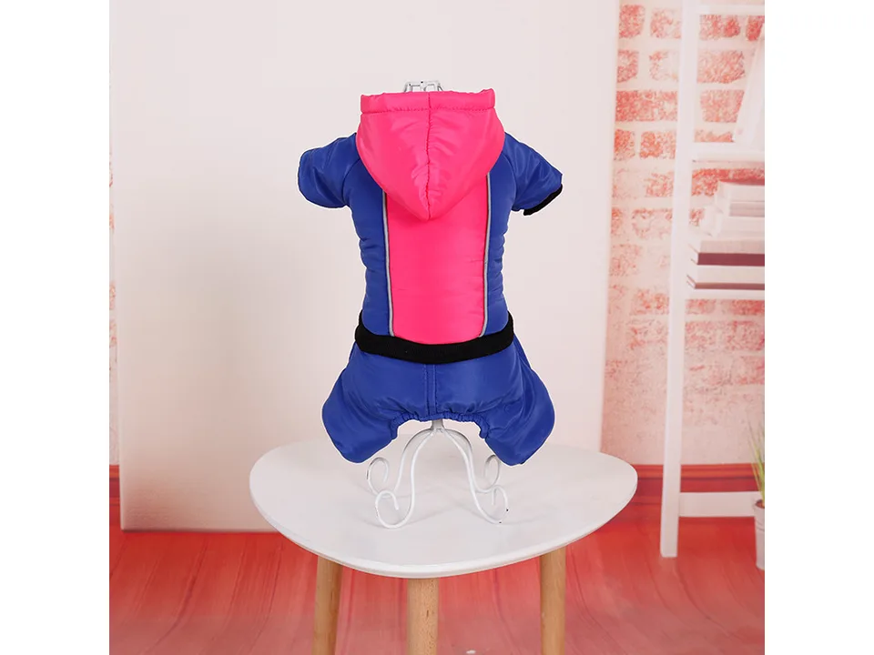 A blue and pink dog jumpsuit with a hood displayed on a mannequin.