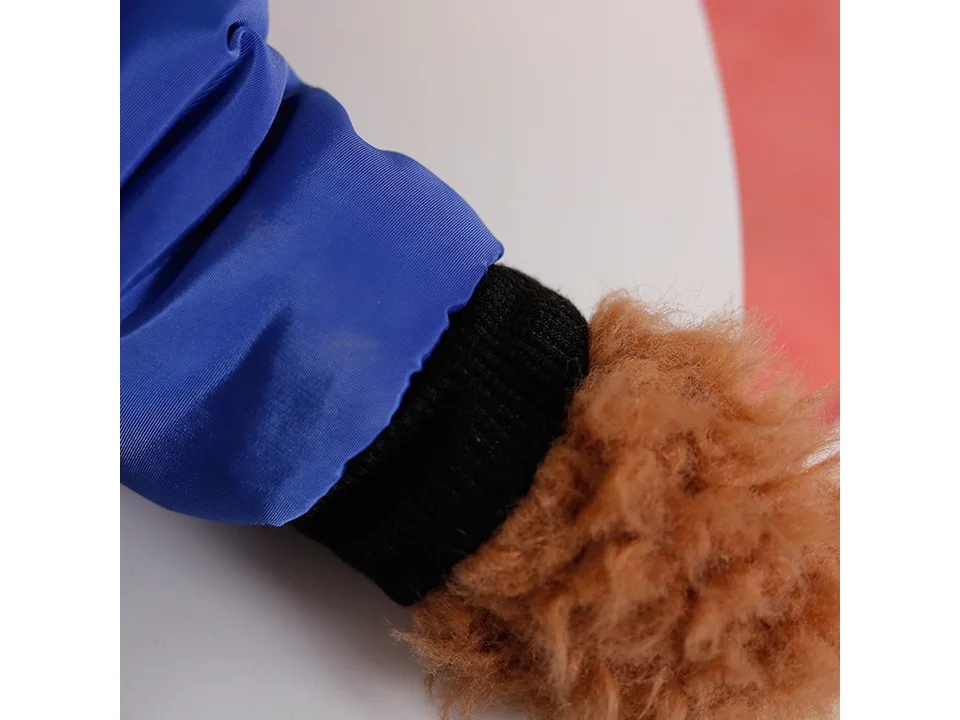 Close-up of the sleeve cuff on the blue dog jumpsuit.