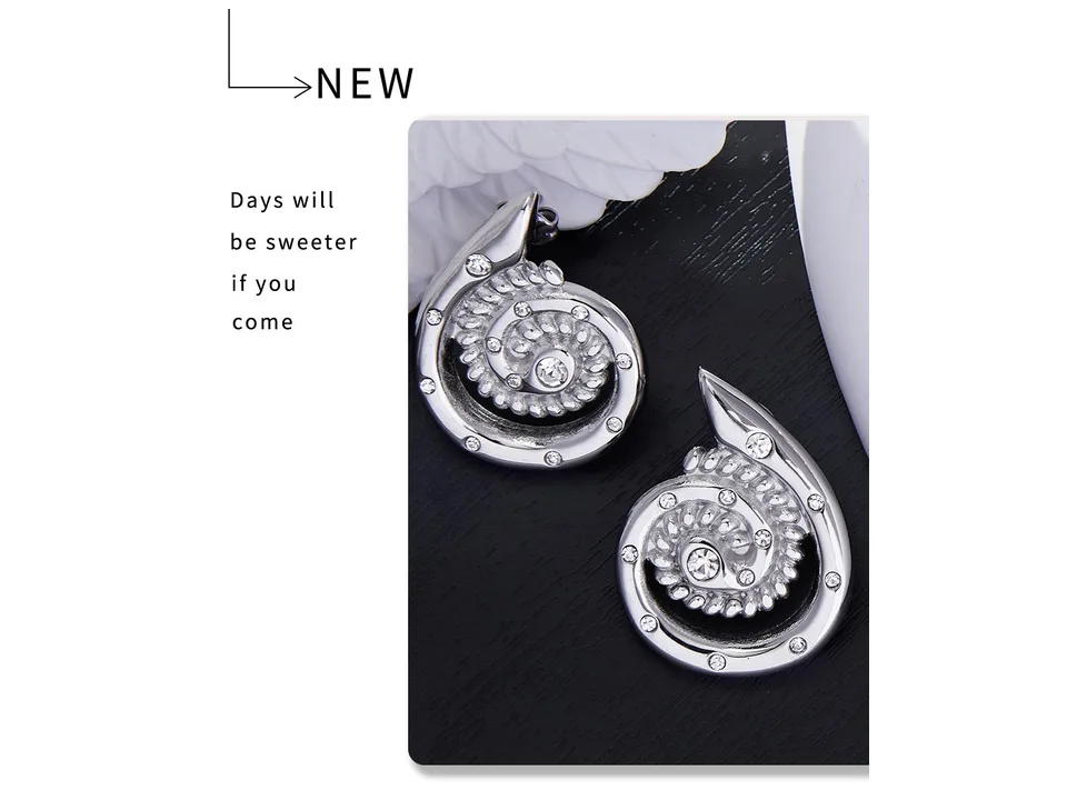 Silver spiral stud earrings with rhinestones