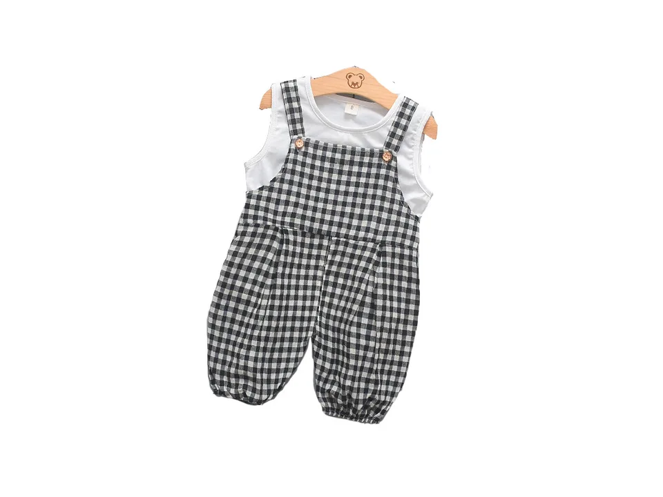 White sleeveless top and black-white plaid bib overalls set.