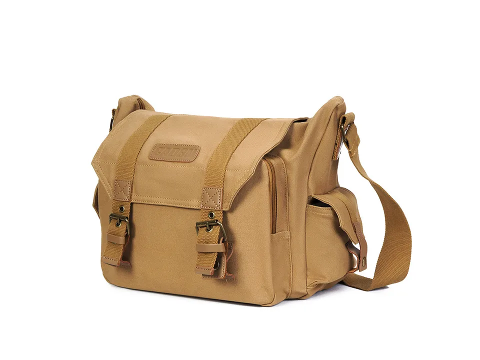 Full view of the tan canvas camera shoulder bag.