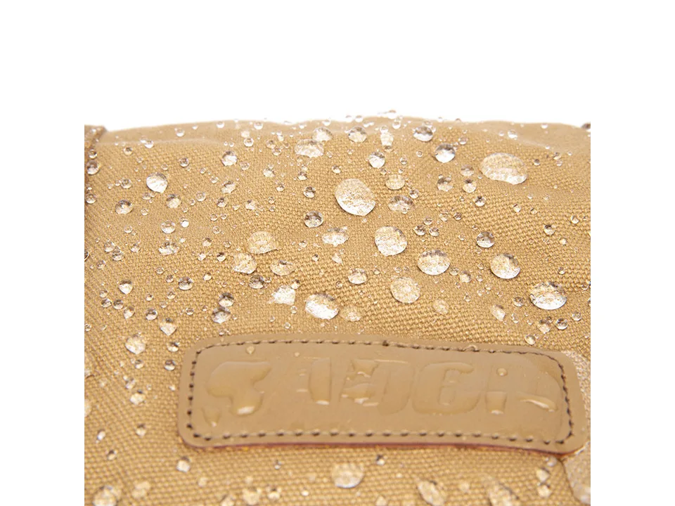 Close-up of water droplets on the canvas fabric of the camera bag.