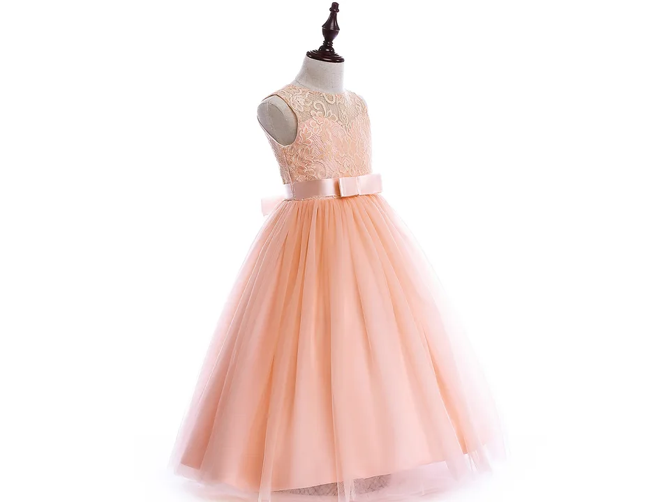 Side view of a peach-colored lace A-line dress on a mannequin.