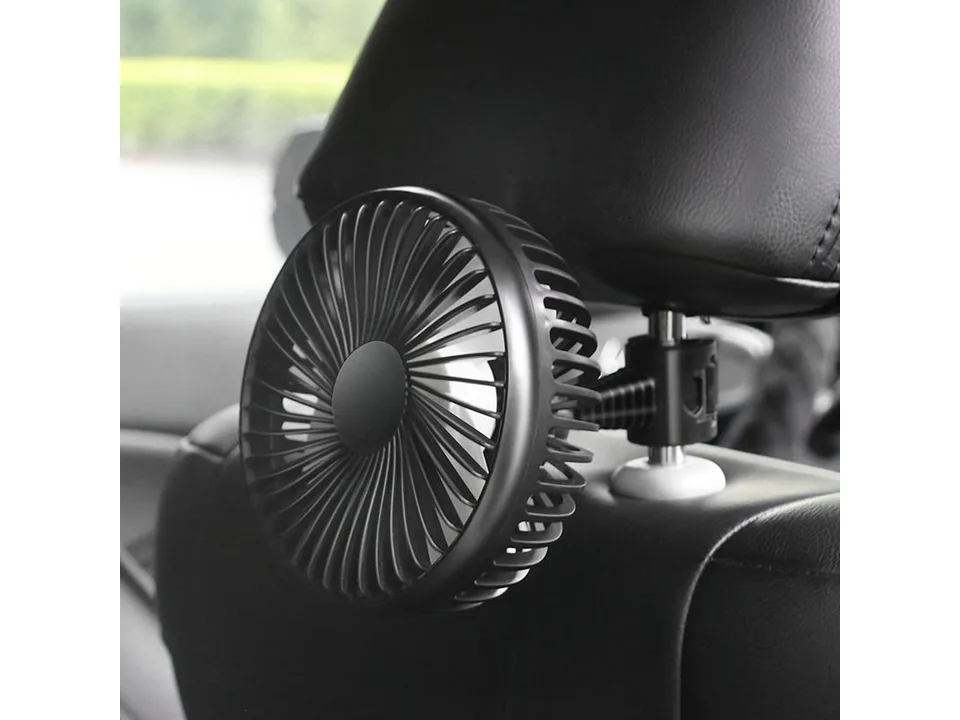 Black car fan mounted on the headrest of a car seat.