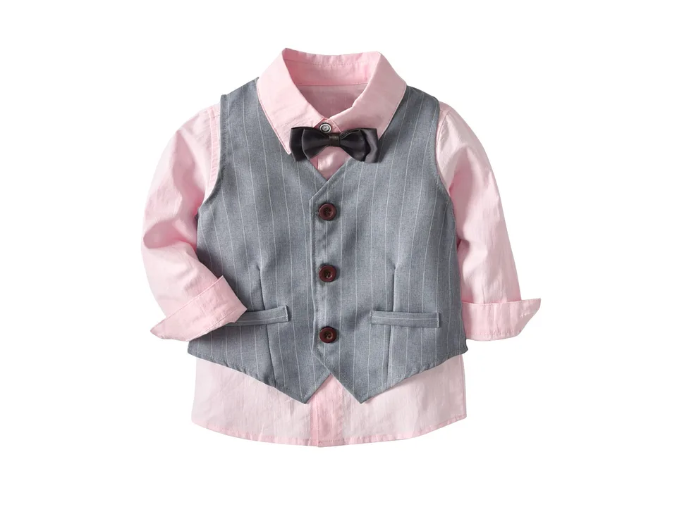 A pink long-sleeve shirt with a grey striped vest and a bow tie.
