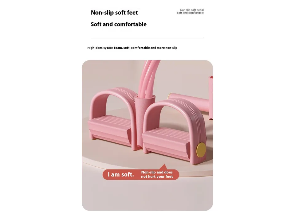 Close-up of the pink non-slip foot pedals on the resistance band.