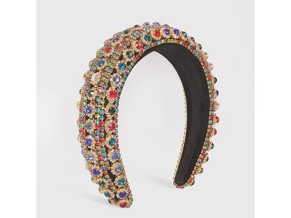 Multi-colored rhinestone headband on a plain background