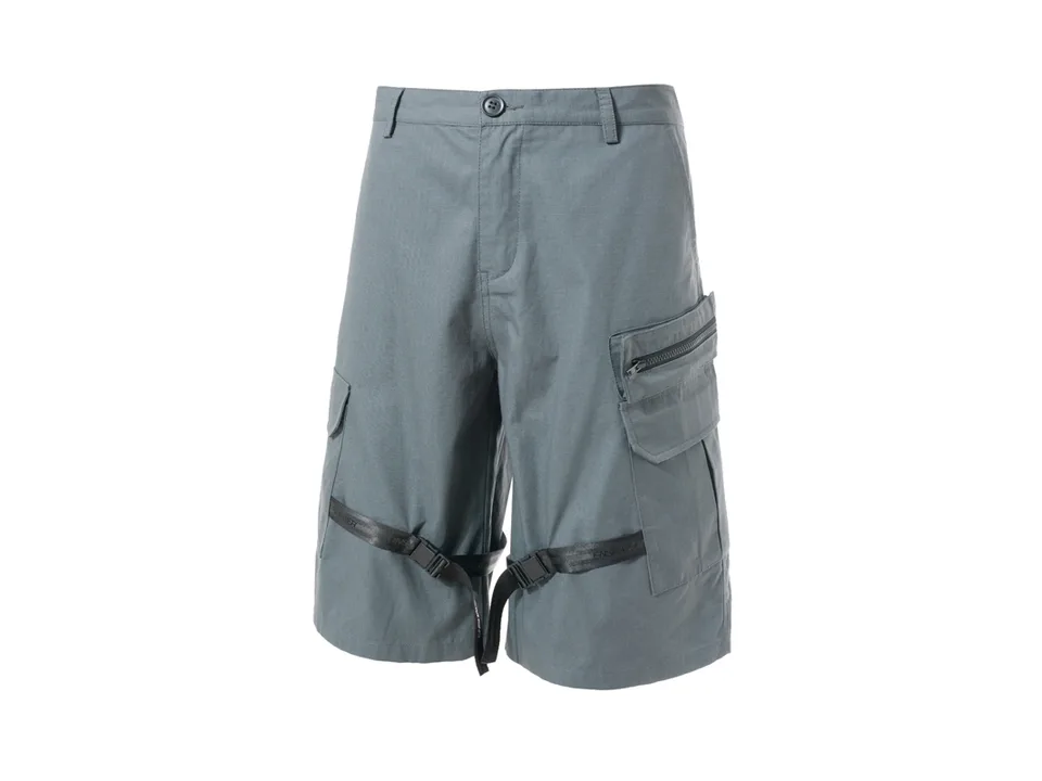A pair of grey tactical cargo shorts with leg straps and pockets on a white background.