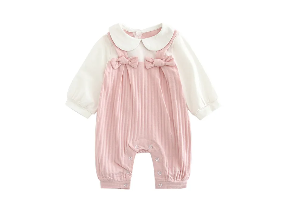 Front view of a pink and white baby jumpsuit with a Peter Pan collar and bow details.