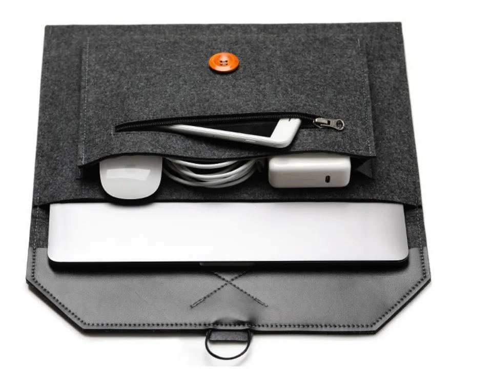 The open laptop sleeve containing a laptop, mouse, charger, and cables.