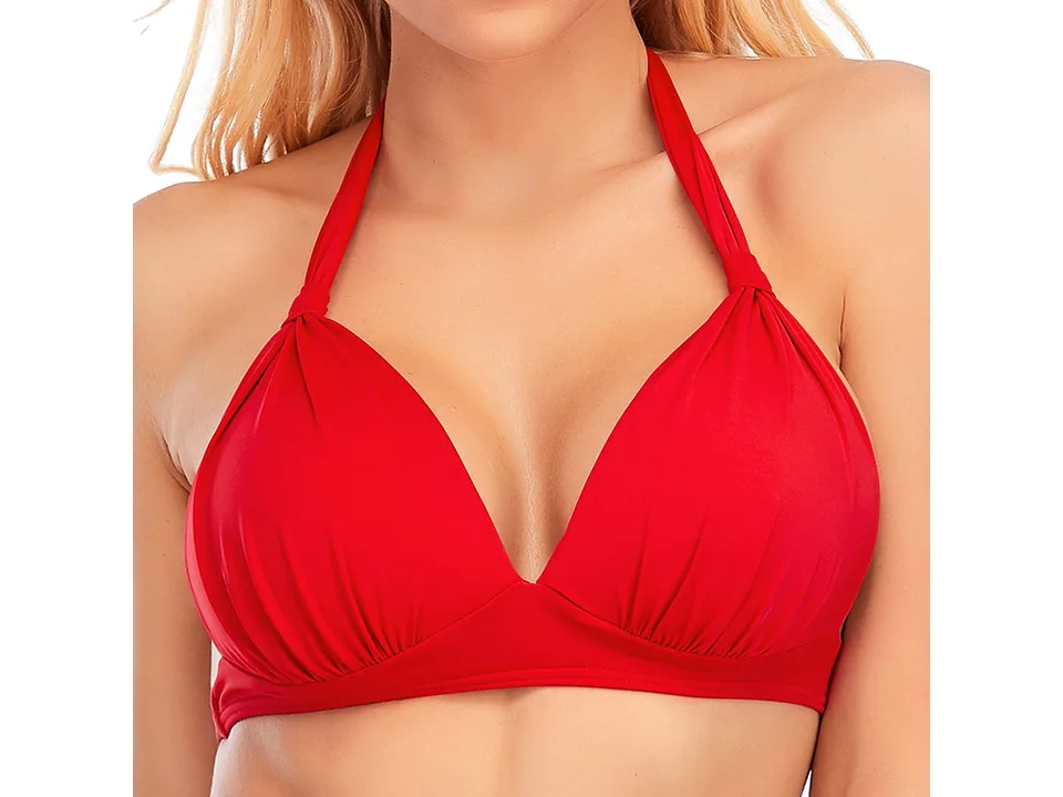 Close-up of a woman wearing a red halter bikini top.