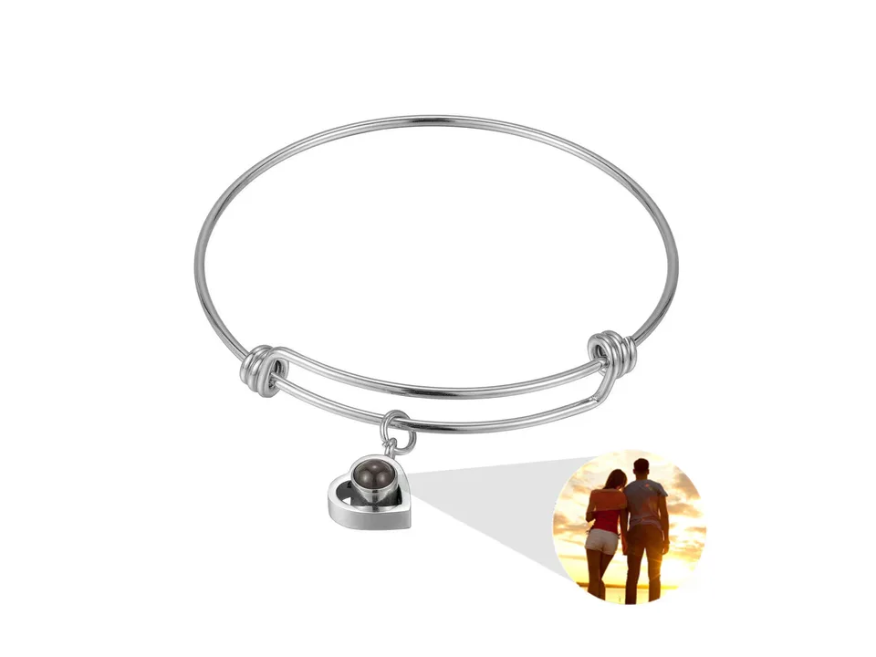 Silver heart-shaped projection bracelet with a sample photo insert.