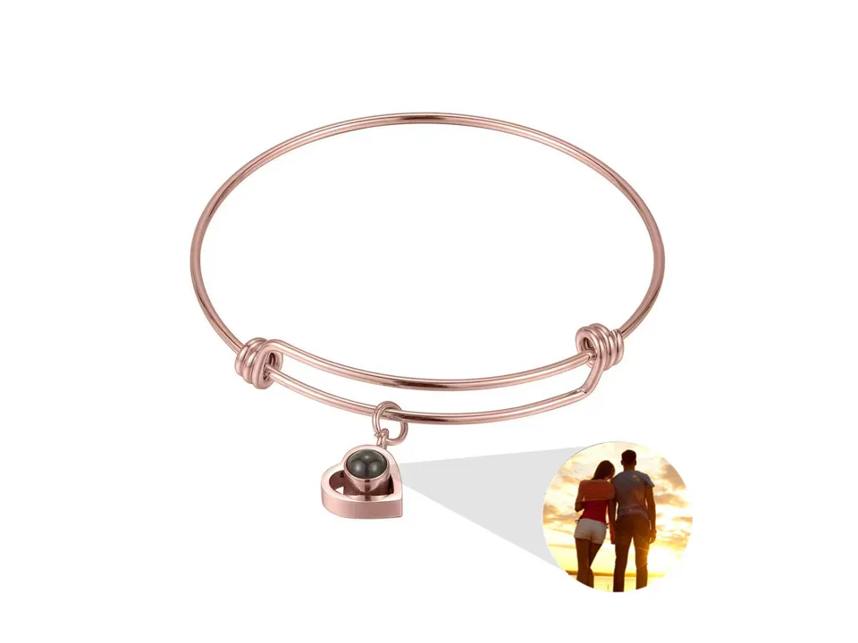 Rose gold heart-shaped projection bracelet with a sample photo insert.