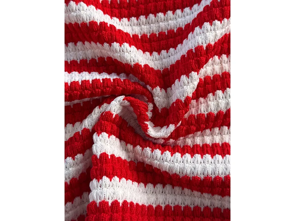 Close-up of the red and white striped textured fabric.