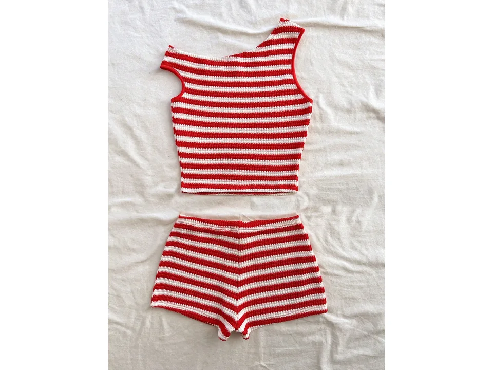 Red and white striped sleeveless crop top and matching shorts laid flat.