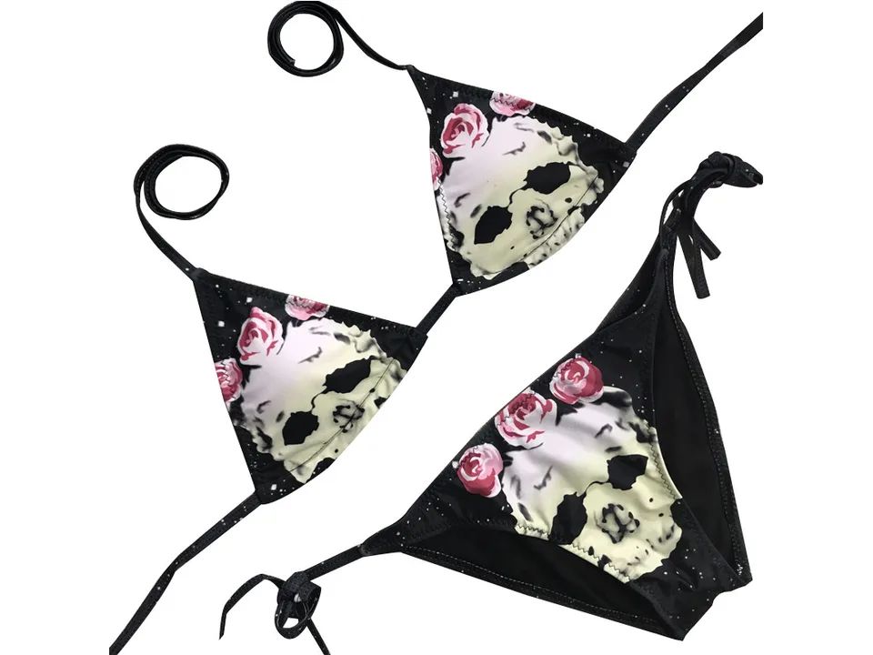 Skull and rose print bikini set with top and bottom pieces.