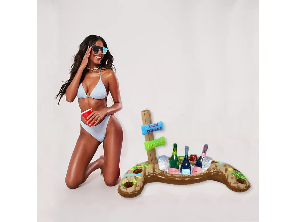 Inflatable tiki-themed pool drink holder with a woman kneeling beside it.