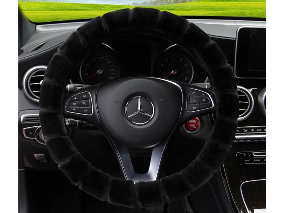 A black plush steering wheel cover installed on a Mercedes steering wheel.