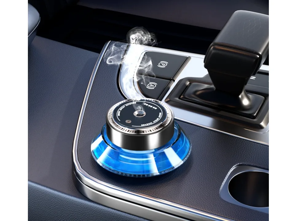 The car aromatherapy diffuser placed on a car center console, emitting mist.