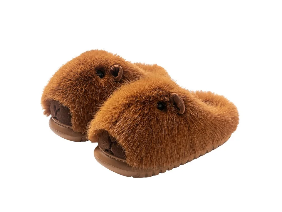 A pair of brown capybara-themed plush slippers on a white background.