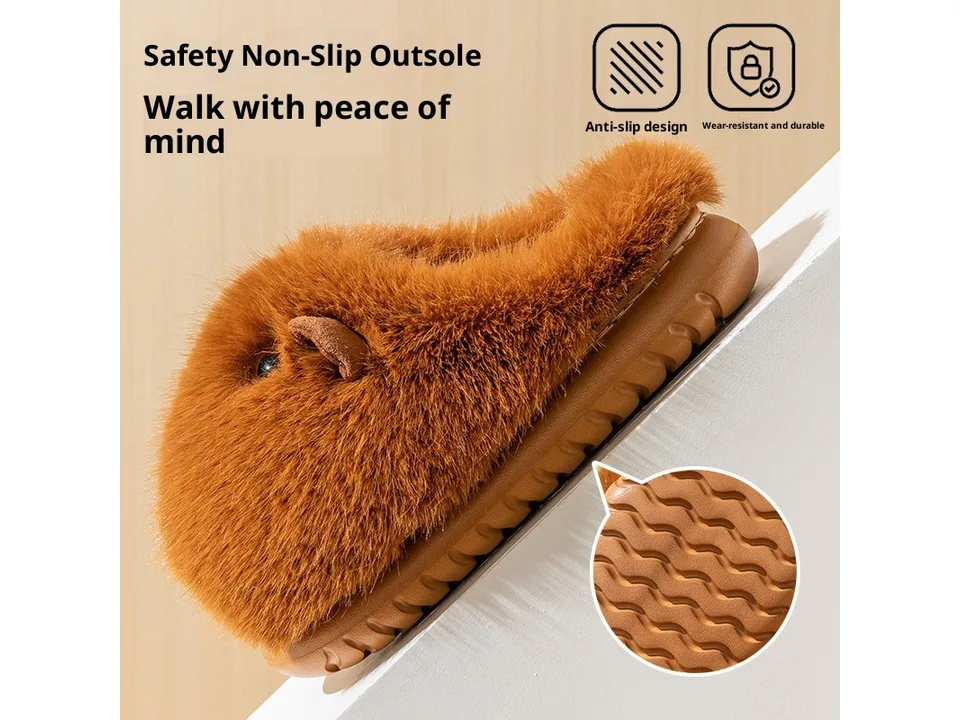 Close-up of the non-slip rubber sole of the brown plush slippers.