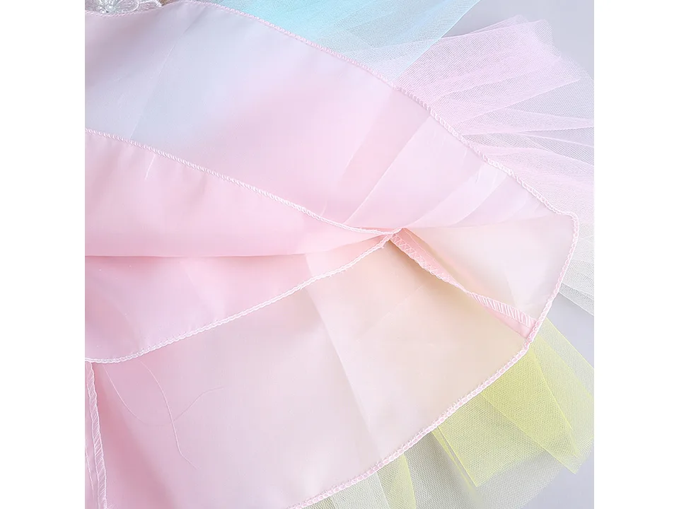 Close-up view of the layered tulle and fabric construction of the dress skirt.