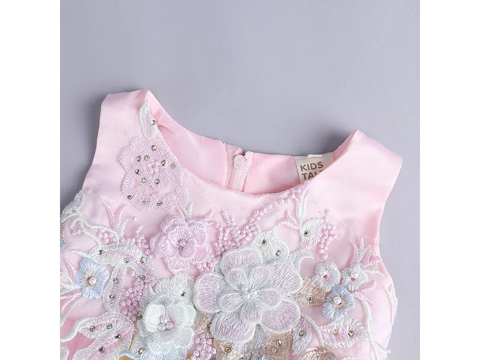 Close-up of the bodice and neckline of the floral baby dress.