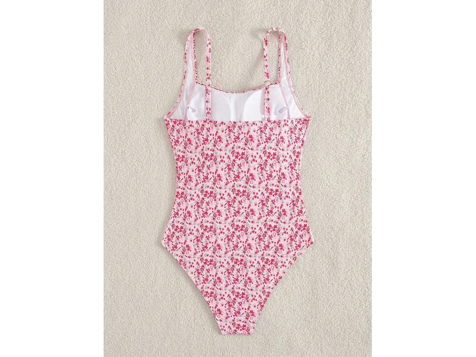 Back view of the pink floral one-piece swimsuit showing straps and interior lining.