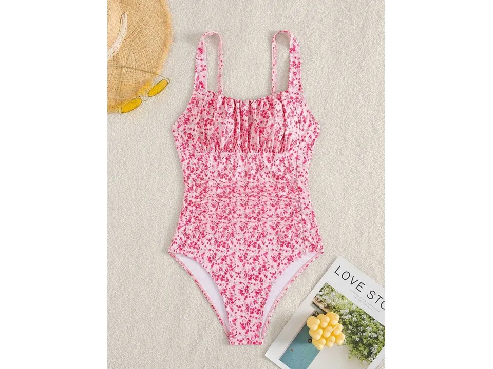 Full view of the pink floral one-piece swimsuit with ruched bodice.