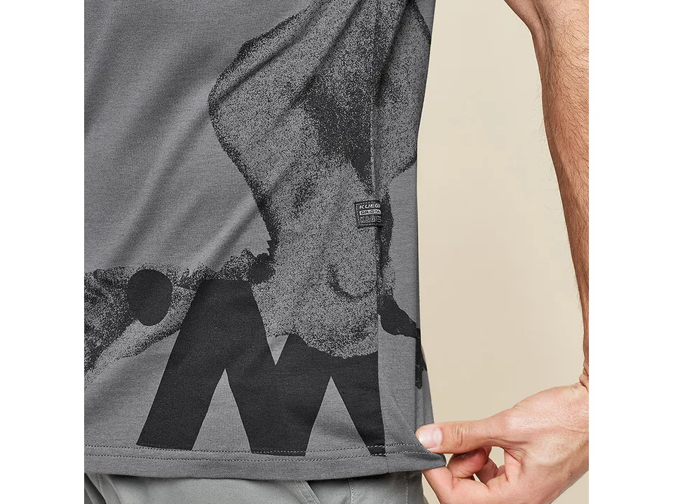 Close-up of the side of the t-shirt showing the fabric texture and a small brand tag.