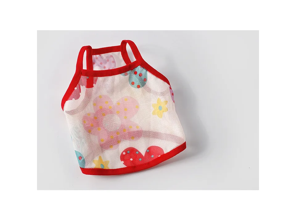 A colorful patterned mesh pet vest with red trim.