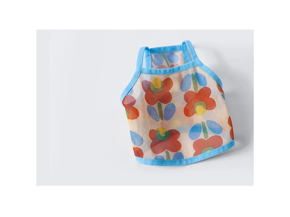 A floral print mesh pet vest with blue trim.