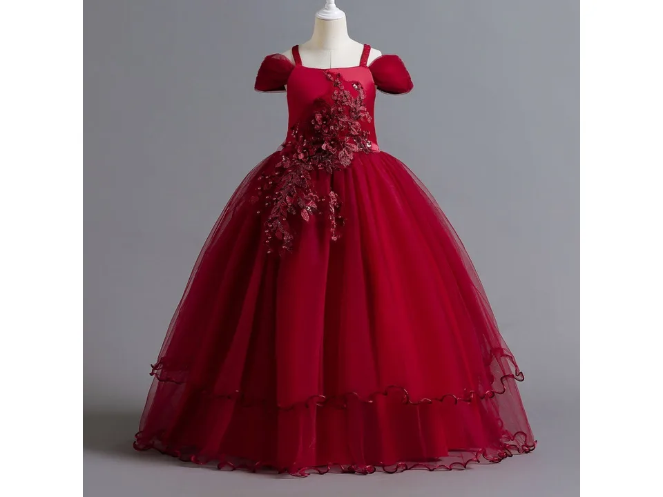 A red formal dress for girls on a mannequin.
