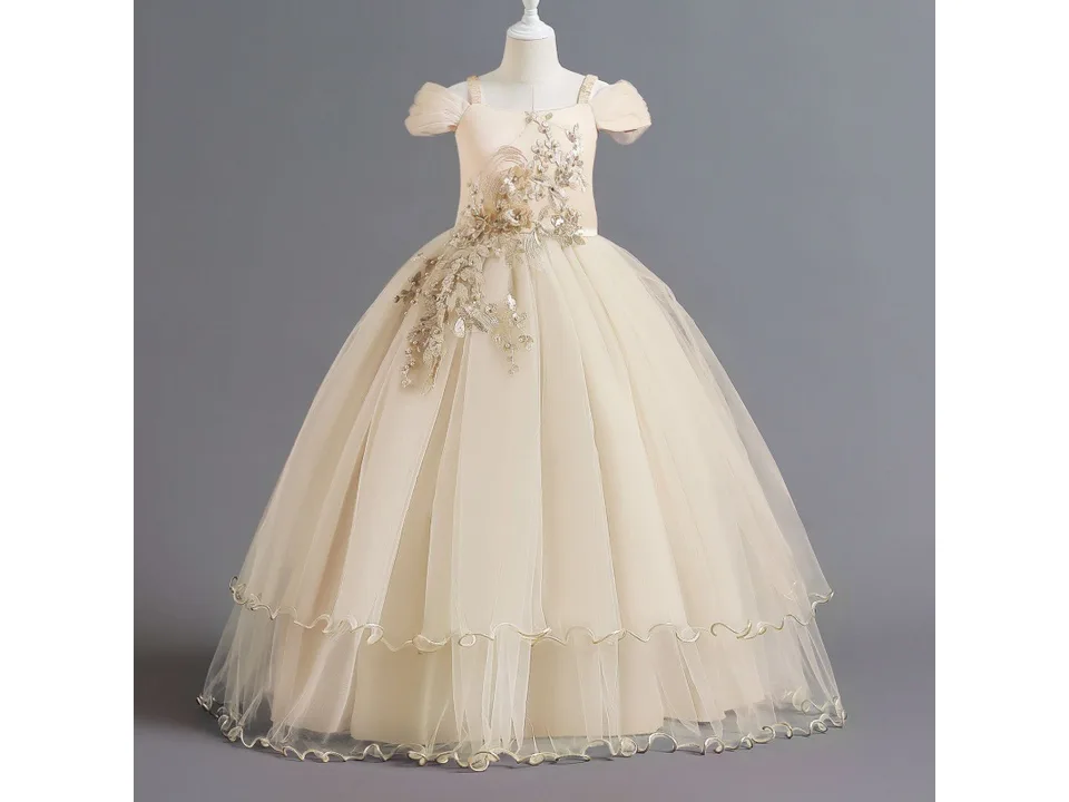 A beige formal dress for girls on a mannequin.
