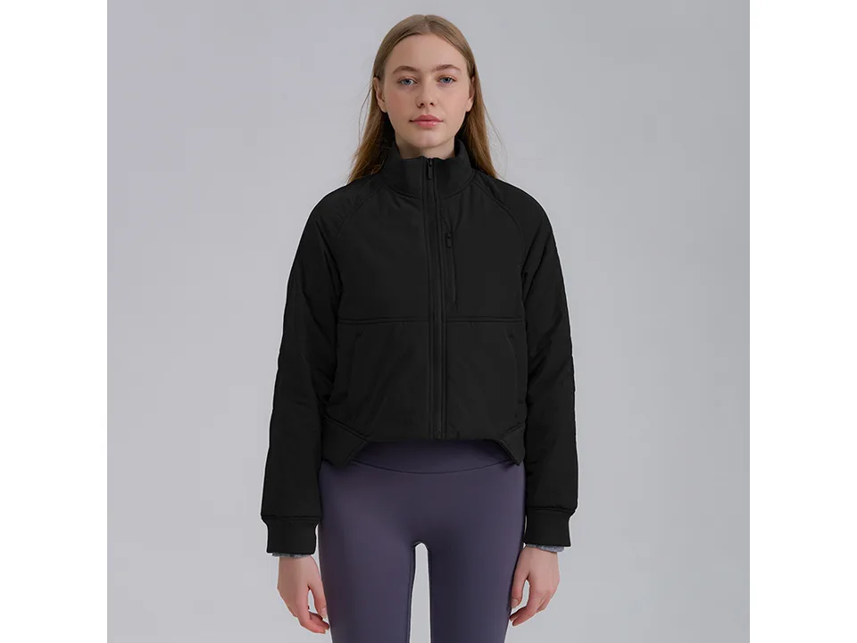 Model wearing a black athletic full-zip jacket with a stand-up collar.