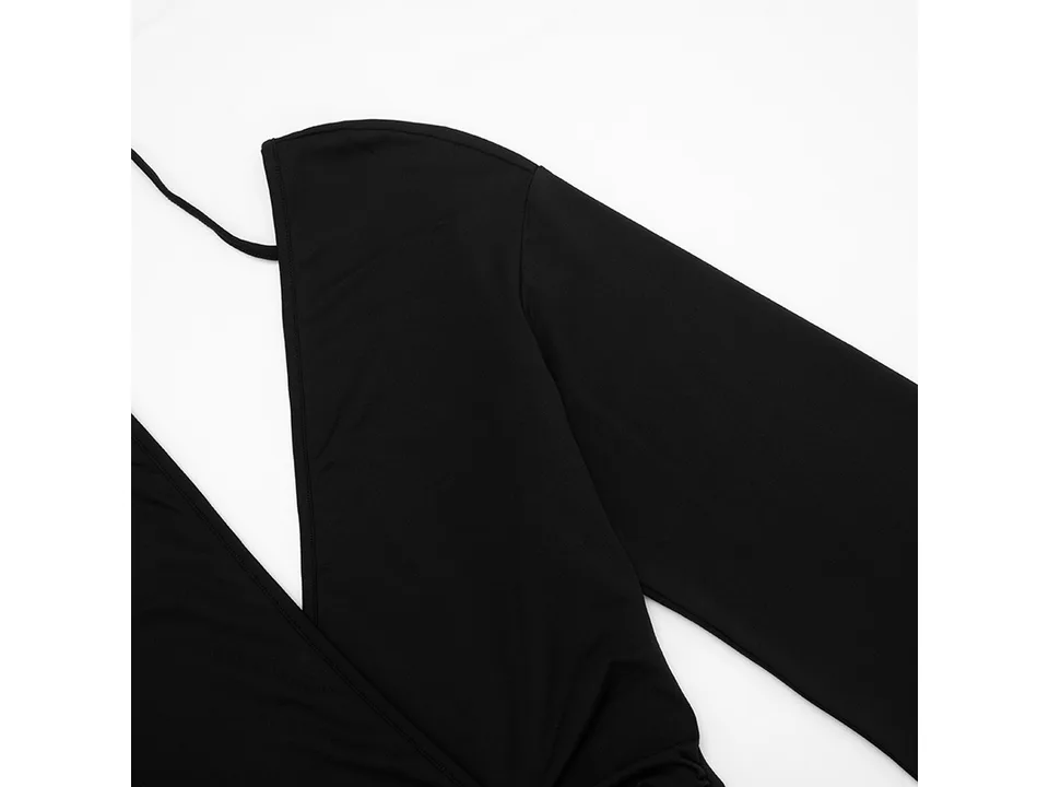 Close-up of the black fabric, V-neckline, and ruched side detail