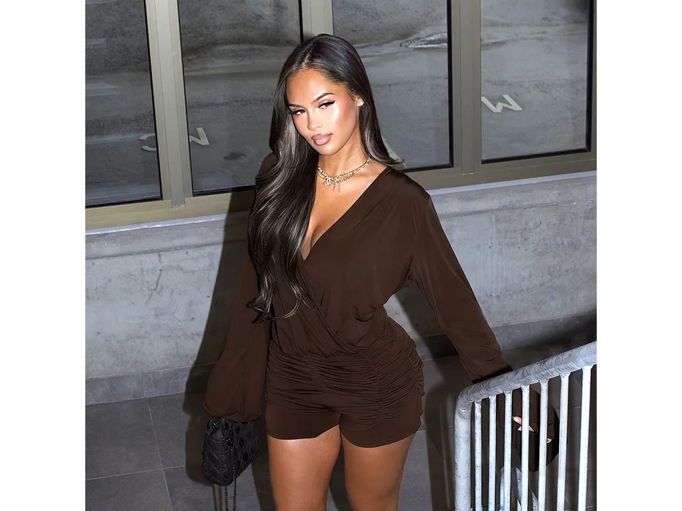 Model wearing the brown version of the long sleeve romper