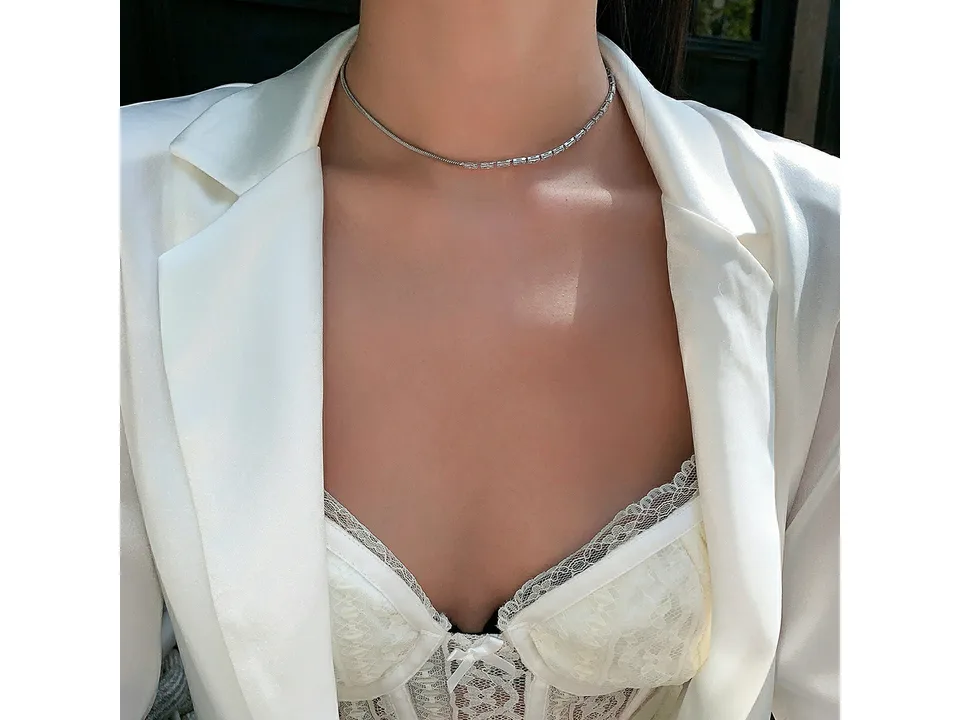 Woman wearing the half chain and half cubic zirconia necklace.