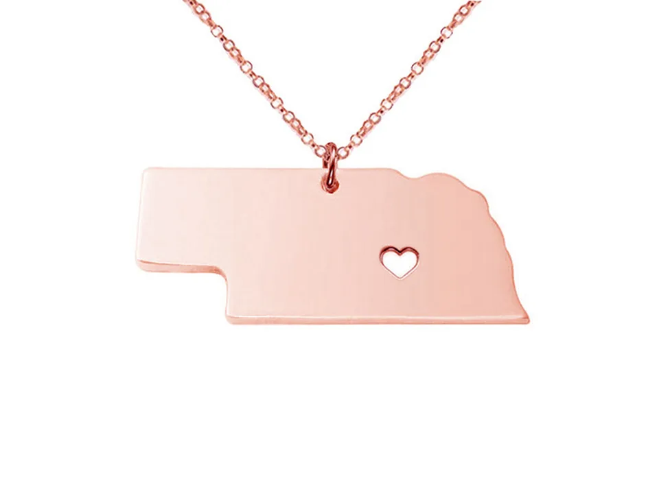 Rose gold-tone Nebraska state map pendant necklace with a heart cutout.