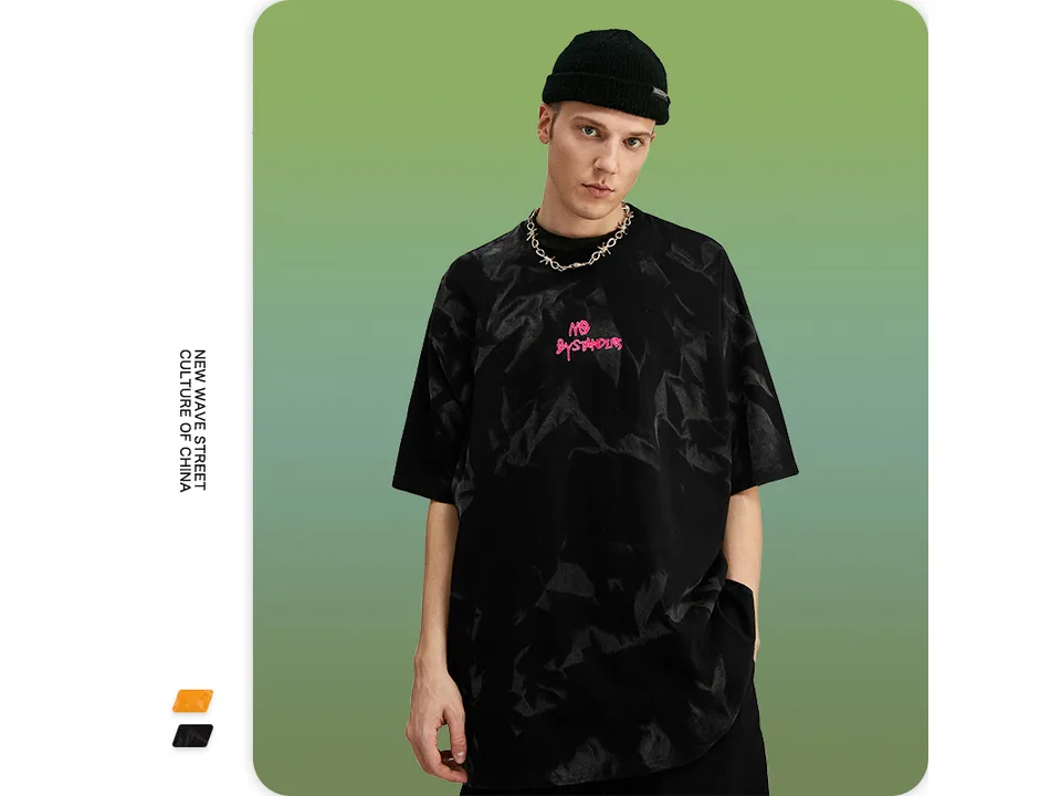 Male model wearing the black oversized tie-dye t-shirt.