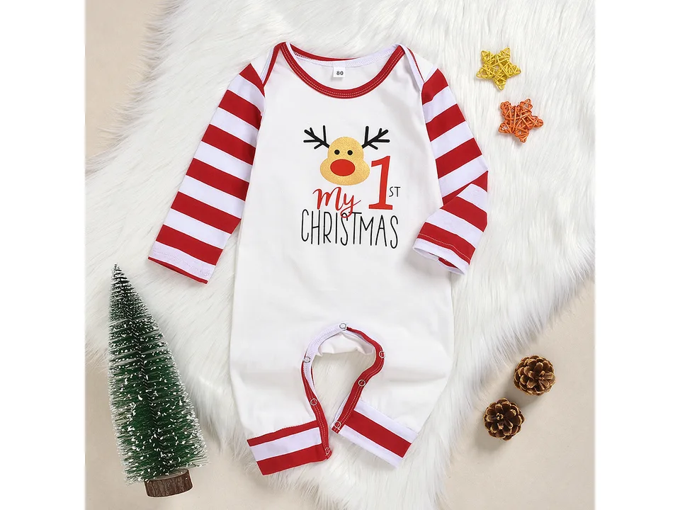 A white baby bodysuit with red and white striped sleeves and a reindeer 'My 1st Christmas' print.