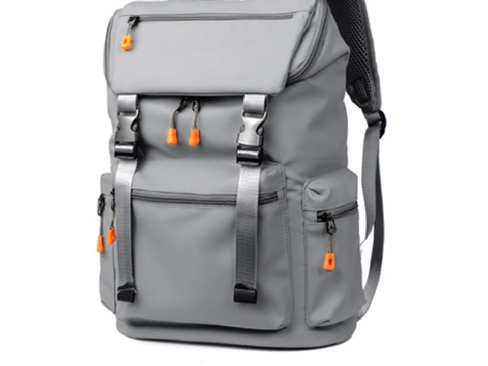 Grey travel backpack, front view, showing pockets and buckles.