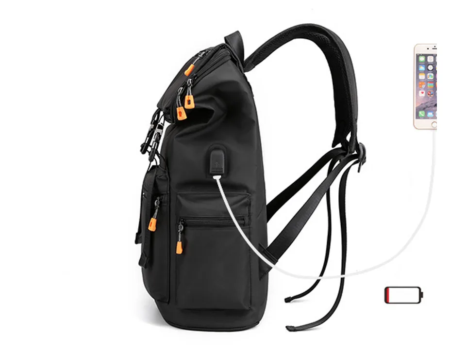 Side view of the backpack showing the external USB charging port connected to a phone.