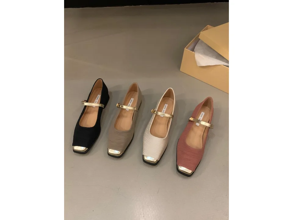 Four pairs of Mary Jane pumps in different colors arranged in a row.