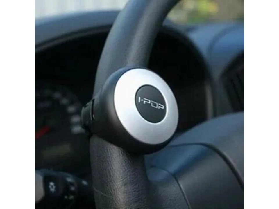 Steering wheel spinner knob mounted on a steering wheel