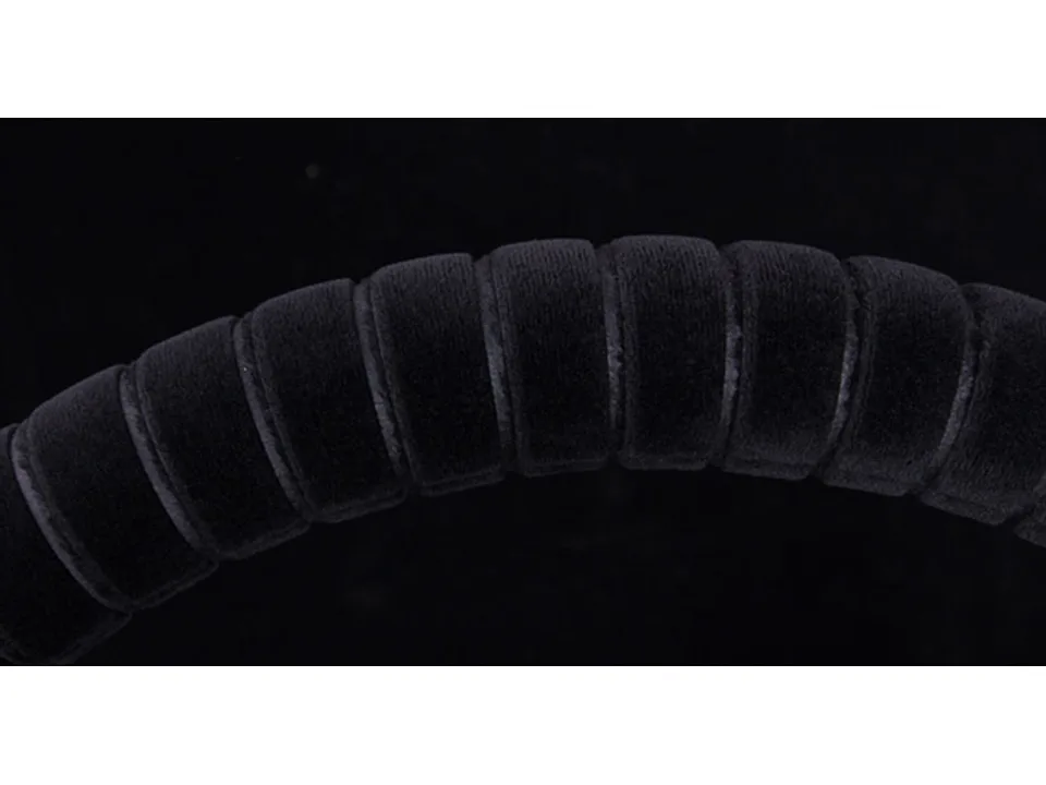 Close-up view of the black plush texture on the steering wheel cover.