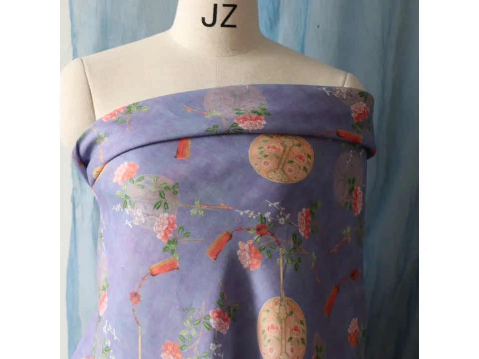 Purple floral print fabric draped over a mannequin torso.