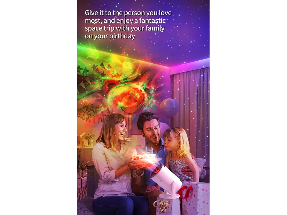 Family celebrating a birthday with the star projector lamp creating a nebula effect in the room.