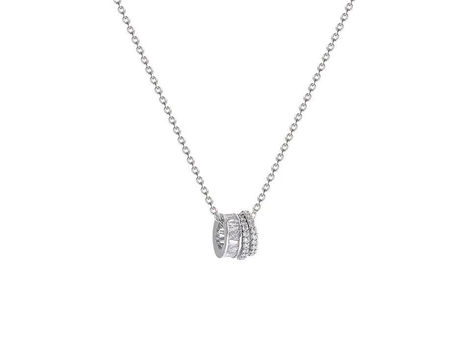 Studio shot of the silver multi-layer ring pendant necklace on a white background.